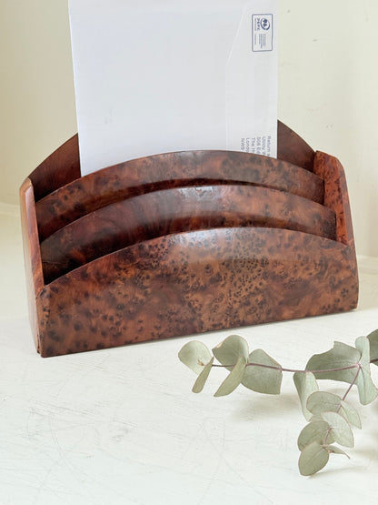 Three-slot curved letter rack made from polished burl wood with rich swirling grain, mid-century style desk organiser.