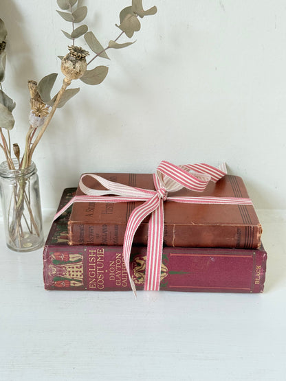 Vintage book bundle of English Costume and History of England with burgundy and brown hardback covers, photographed on a white surface