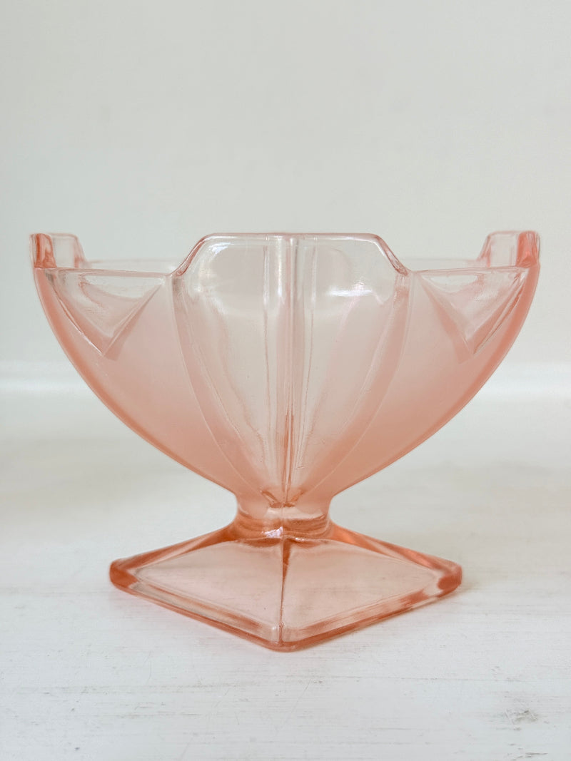 Art Deco pink pressed glass dessert service with scalloped serving bowl and four footed sundae dishes