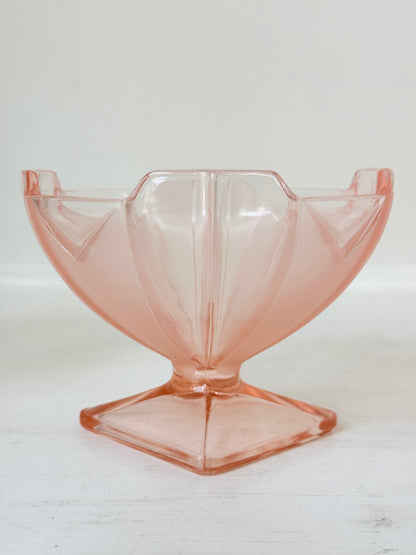 Art Deco pink pressed glass dessert service with scalloped serving bowl and four footed sundae dishes