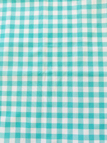 Blue Loft cotton tea towel duo with turquoise gingham check and blue toile pattern photographed in a kitchen setting.