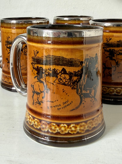 Set of 4 Ridgways stoneware tankard mugs photographed on a white surface in amber brown treacle glaze with black Coaching Days and Coaching Ways transfer scenes