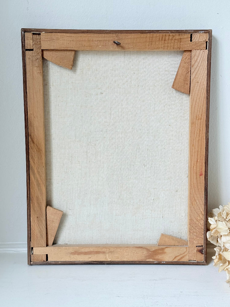 Vintage framed oil painting of horse and cart scene signed L. Cabanes photographed on a white surface