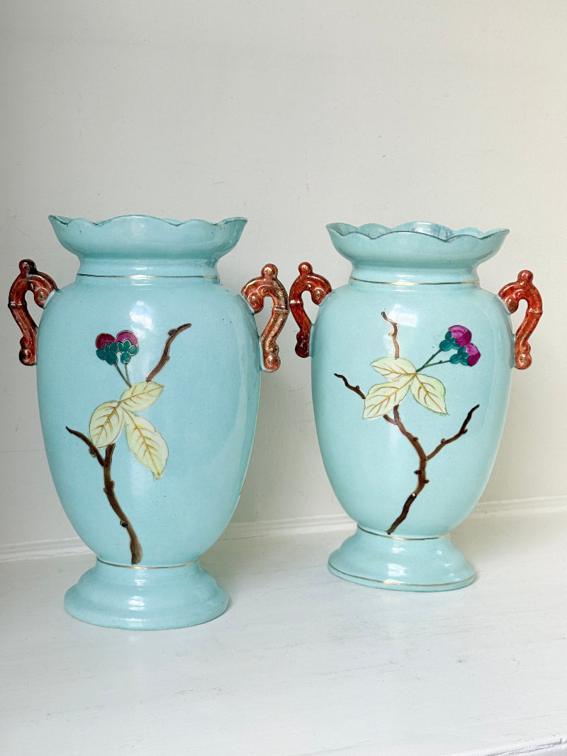 Pair of Paris porcelain Aesthetic Movement vases from the late 1800s, hand painted with birds, blossom and coral handles