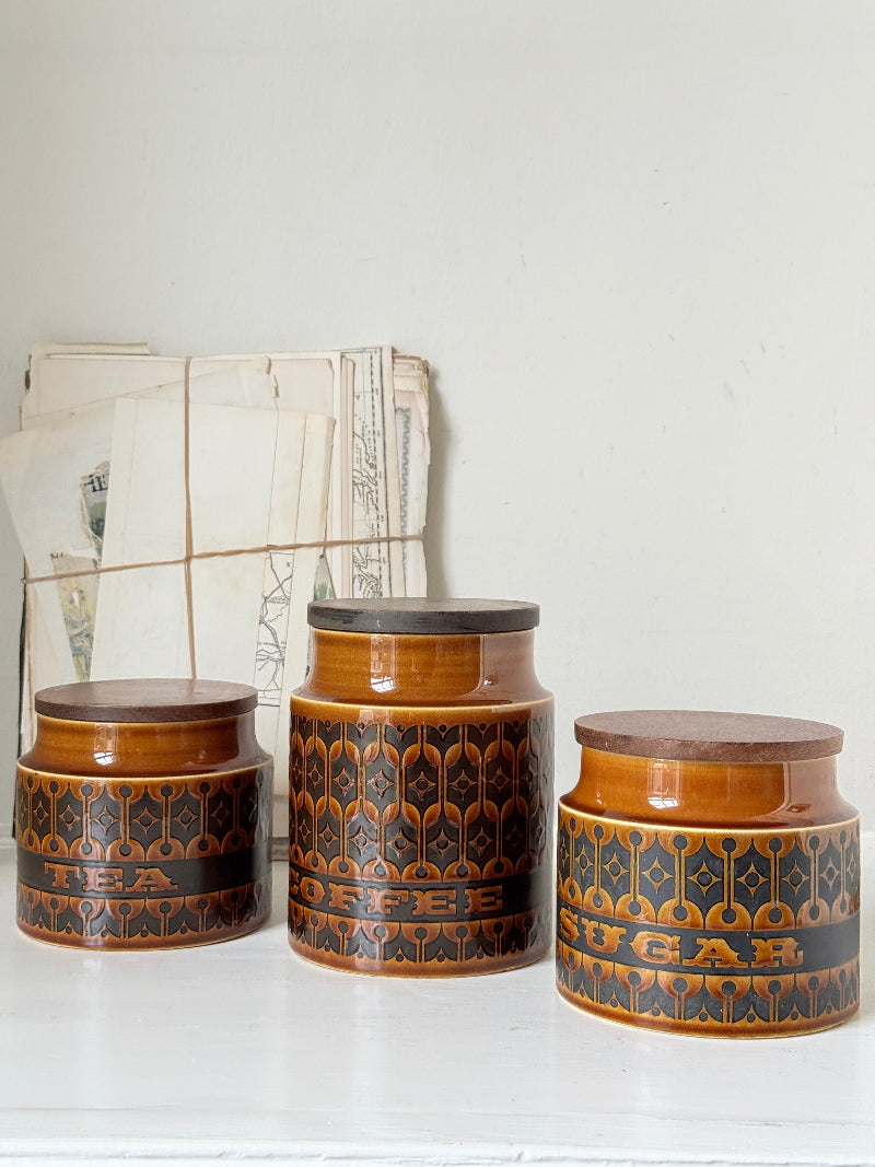 Hornsea Heirloom coffee tea and sugar canister set in autumn brown stoneware with teak lids photographed on a white surface