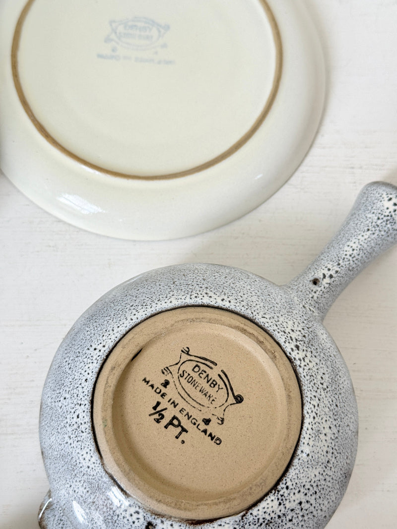 Denby Studio pair of lidded soup bowls with stands in grey and rust photographed on a white surface