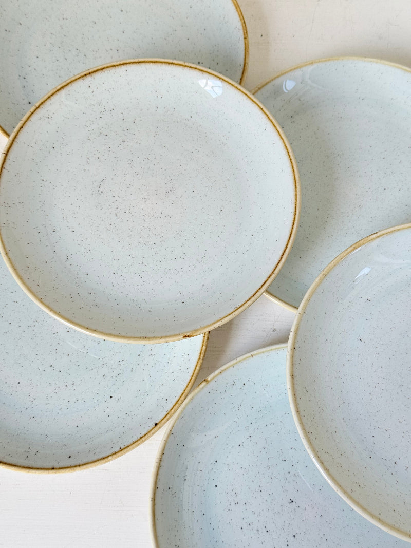 Set of 8 Churchill speckled duck egg side plates with warm rim photographed on a white surface