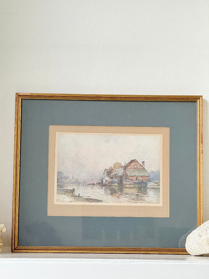 Vintage framed print of riverside mill by F Robson, gilt frame with blue mount, rustic water scene, photographed on white surface.