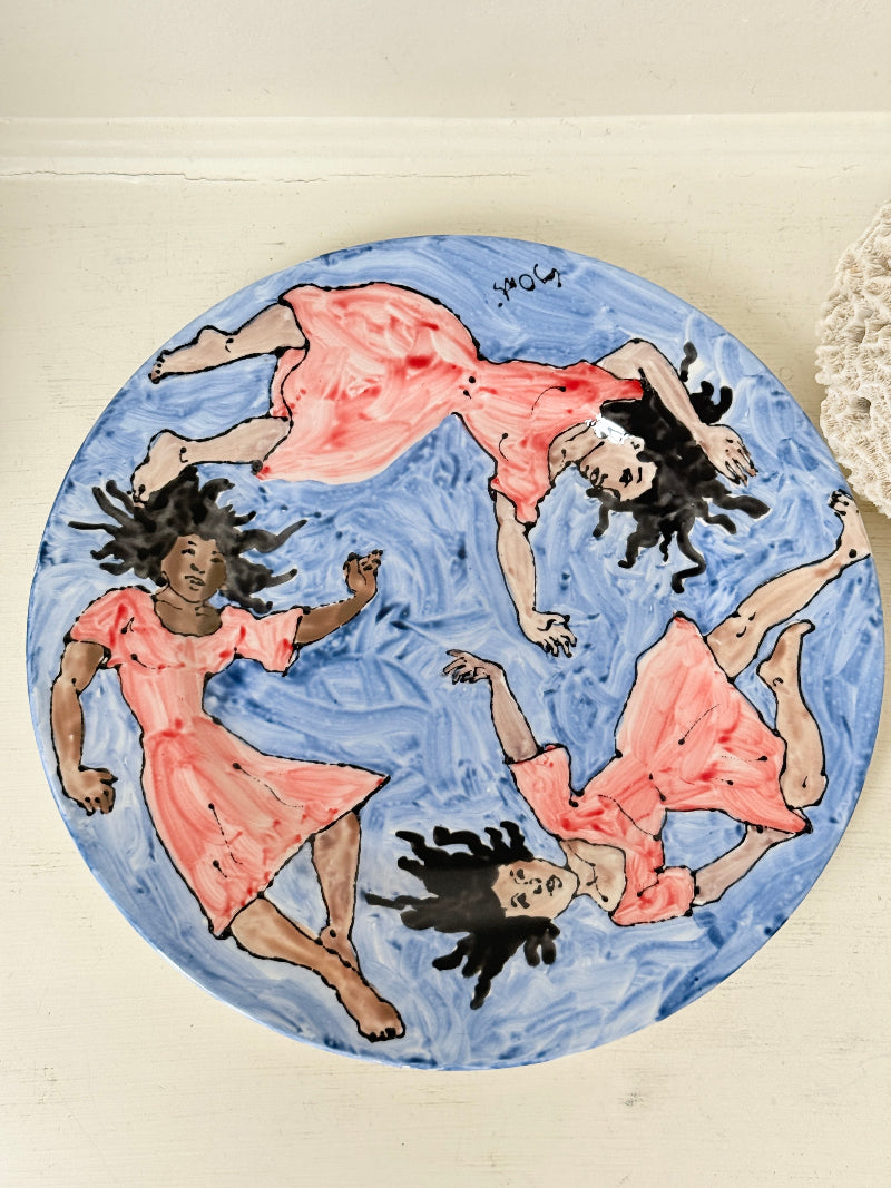 Signed Cary Outis studio art ceramic plate with figurative swimmers, blue painted ground and original Little Ouse artist label