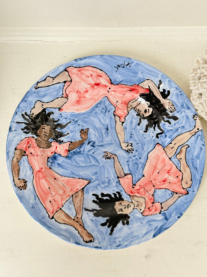 Signed Cary Outis studio art ceramic plate with figurative swimmers, blue painted ground and original Little Ouse artist label