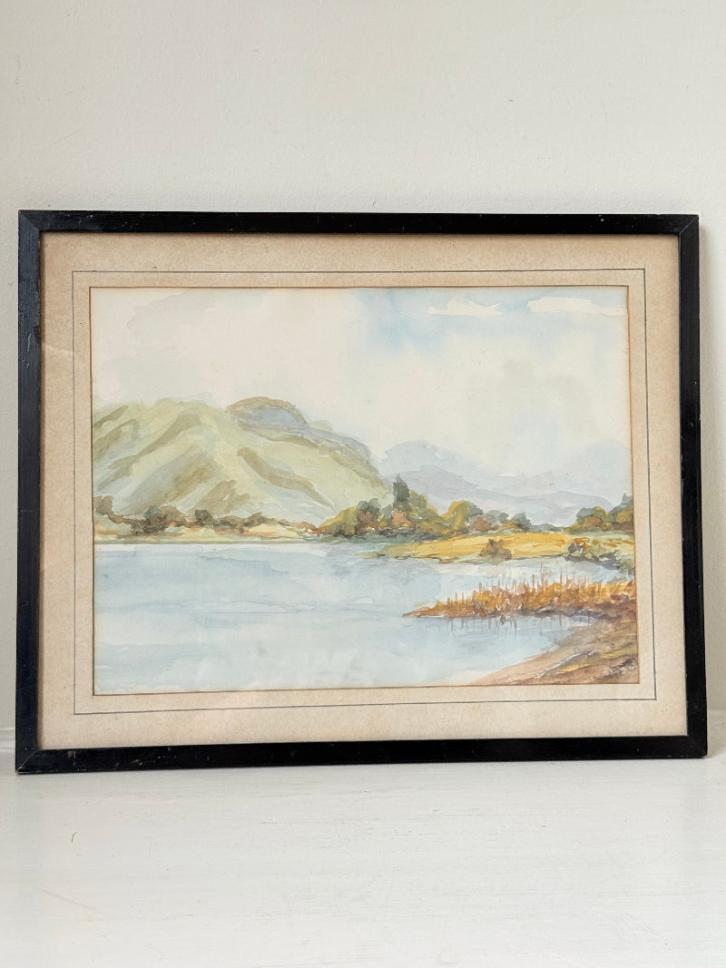 Vintage signed watercolour landscape of mountains and lake in black frame