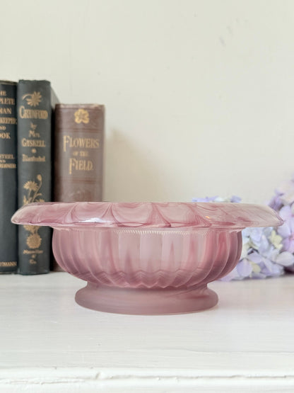 Davidson Cloud Glass bowl in amethyst with swirl pattern and footed base, styled with books and hydrangeas
