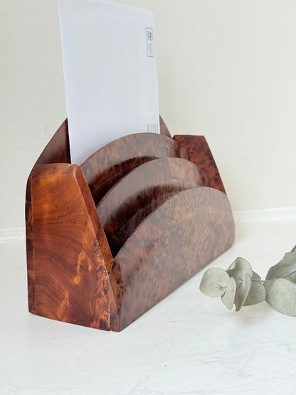 Three-slot curved letter rack made from polished burl wood with rich swirling grain, mid-century style desk organiser.