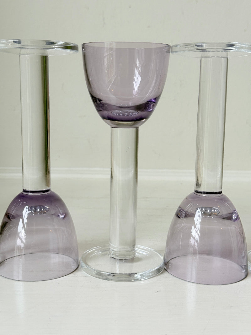 Set of 8 vintage lilac tinted liqueur glasses on a white surface