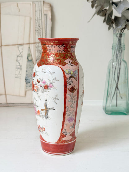 Japanese Kutani porcelain vase hand painted with flowers in white panels on an iron red and gold ground