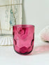 Vintage cranberry glass beaker with honeycomb optic pattern, deep pink colour and textured moulded glass for shelf styling