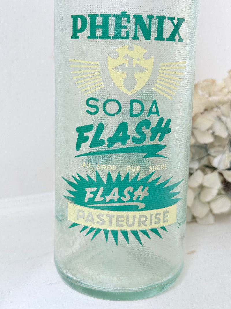 vintage french soda bottle phenix aqua green glass with ceramic swing top 31cm on white surface