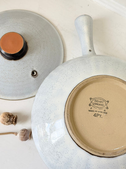 Denby Studio large two handled lidded casserole in grey and rust photographed on a white surface