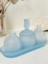 Vintage powder blue frosted glass dresser set with tray and three matching pieces, photographed on a white surface