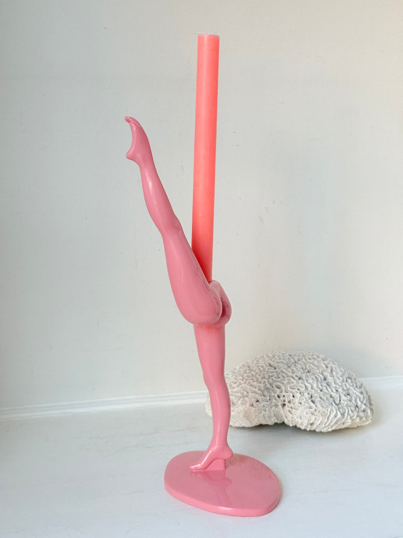 Anissa Kermiche Can Can Candlestick in Shine Pink resin with sculptural kicking leg design and taper candle