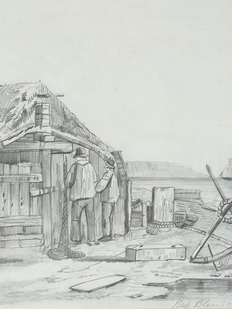 Vintage pencil drawing of rural scene with outbuildings and figures, under glass in black wooden frame, photographed on white surface.