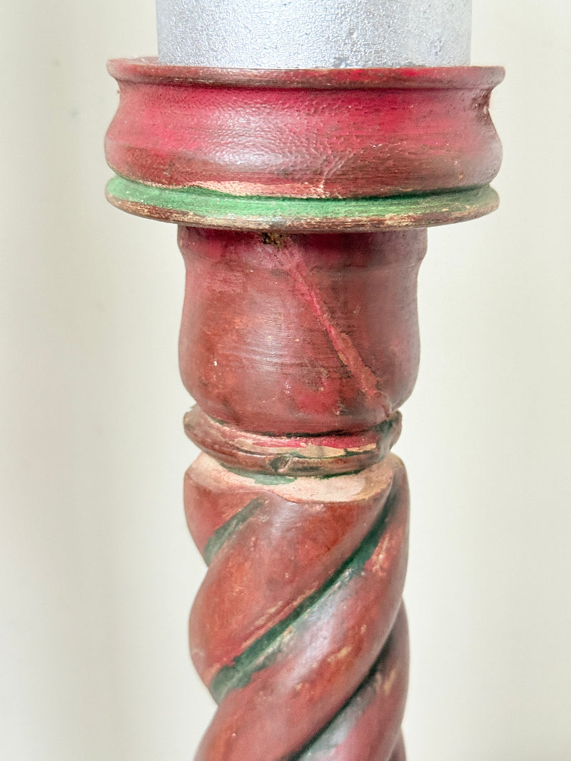 Vintage wooden barley twist candlesticks, a pair with painted finish, photographed on a white surface