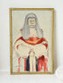 Vintage framed print of judge in ceremonial robes with humorous grumpy expression, photographed on a white surface

