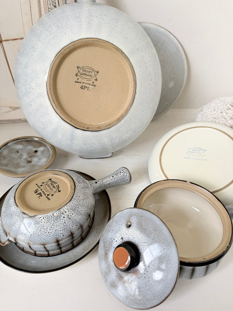 Denby Studio stoneware casserole and soup bowl set in grey and rust photographed on a white surface