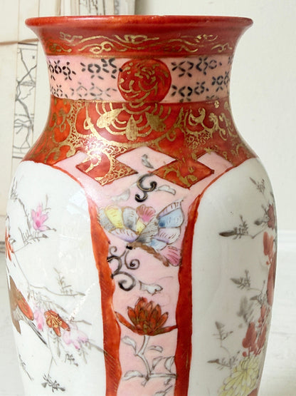 Japanese Kutani porcelain vase hand painted with flowers in white panels on an iron red and gold ground