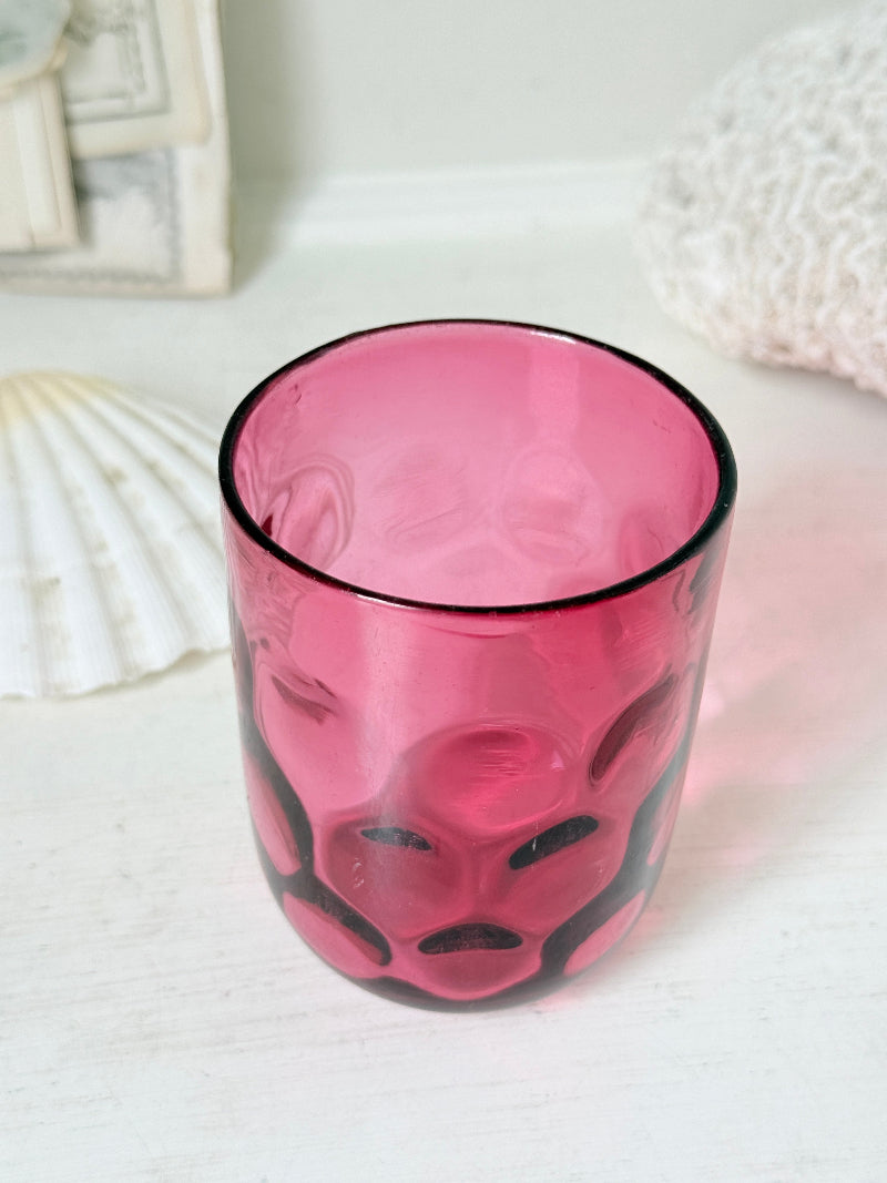 Vintage cranberry glass beaker with honeycomb optic pattern, deep pink colour and textured moulded glass for shelf styling
