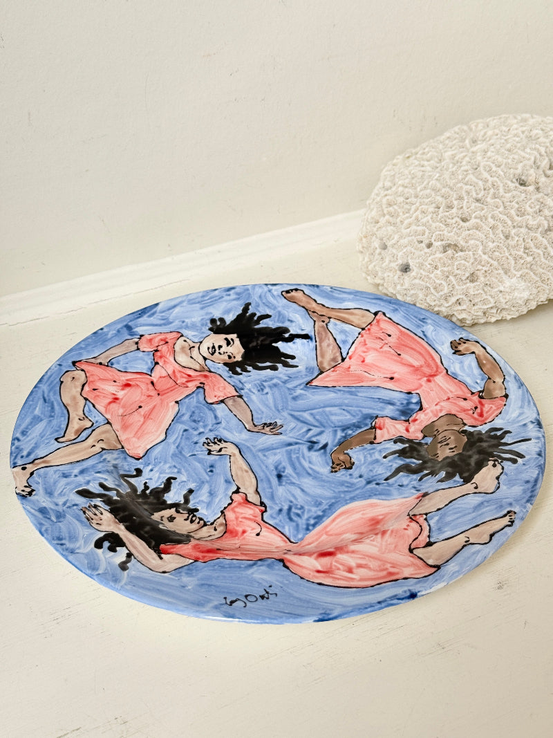 Signed Cary Outis studio art ceramic plate with figurative swimmers, blue painted ground and original Little Ouse artist label