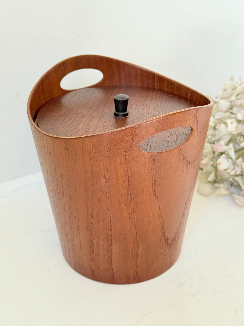 Vintage Swedish teak ice bucket with lid and white liner, photographed on a white surface