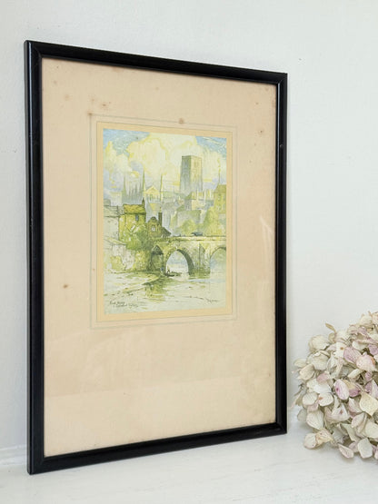framed print of durham cathedral and elvet bridge with soft green and yellow tones photographed on white surface