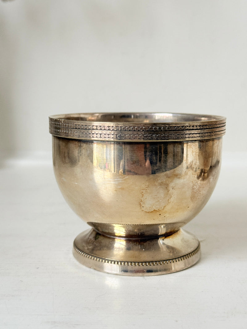 Vintage silver plated on brass sugar bowl and milk jug set, photographed on a white surface
