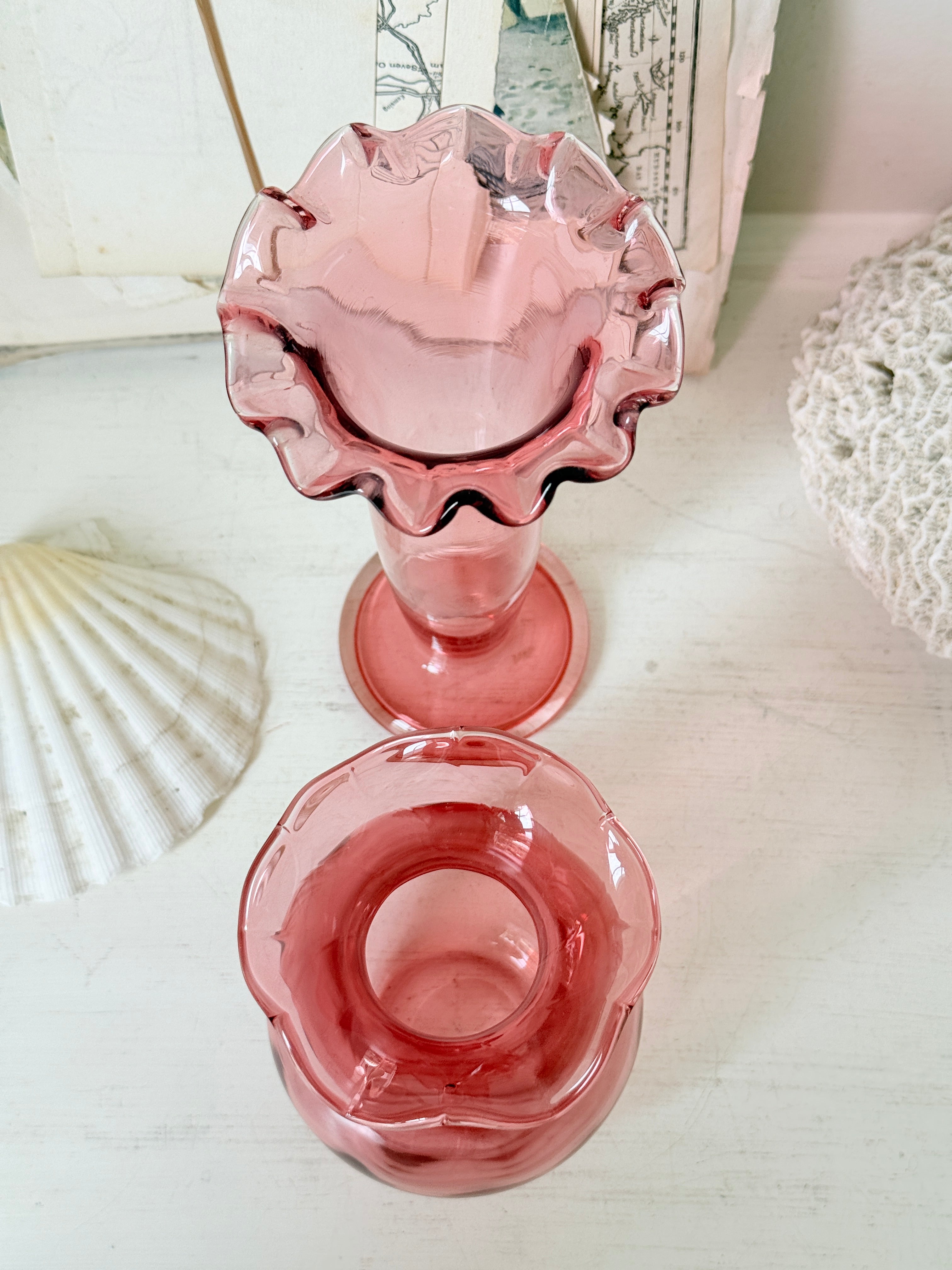 Pair of cranberry glass vases with crimped frill rims, trumpet vase and bulbous bud vase in soft pink glass