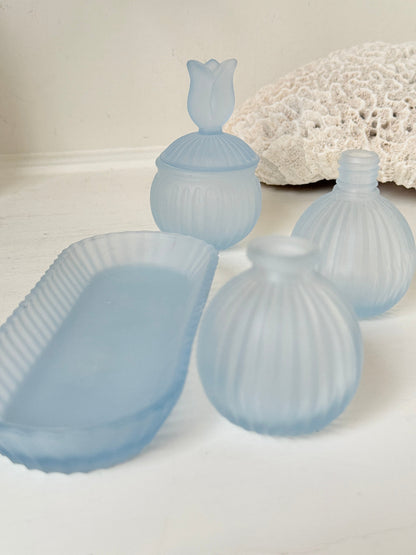 Vintage powder blue frosted glass dresser set with tray and three matching pieces, photographed on a white surface