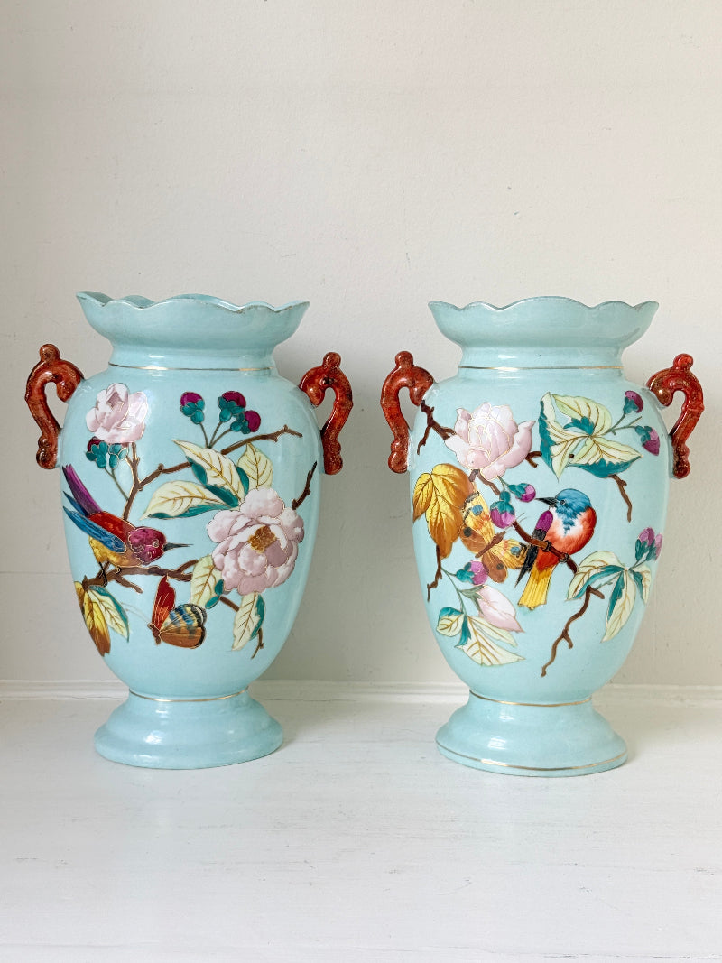 Pair of Paris porcelain Aesthetic Movement vases from the late 1800s, hand painted with birds, blossom and coral handles
