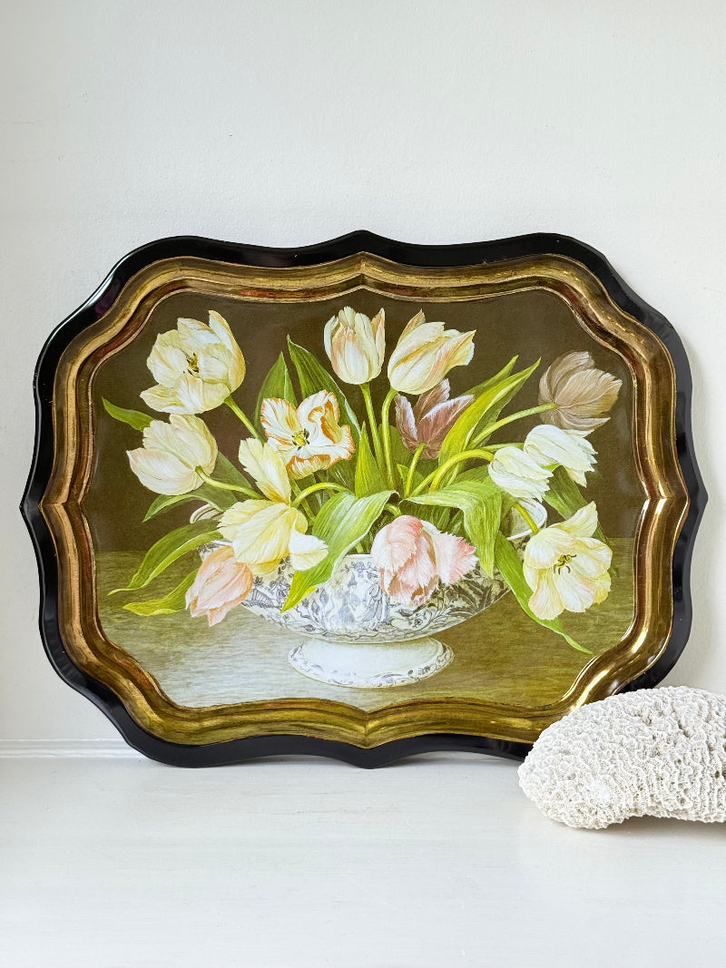Large vintage printed tulip tray with scalloped edge and black lacquered finish, photographed on white surface.
