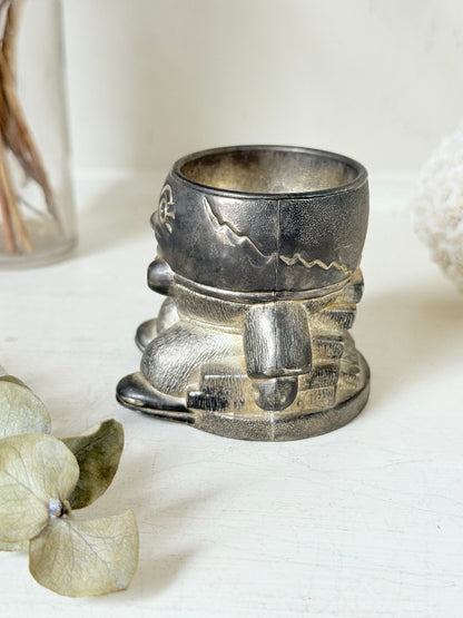 Vintage Humpty Dumpty silver plate egg cup, photographed on a white surface