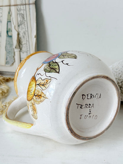 Vintage Deruta Italian hand painted maiolica jug with fruit and vine motif, yellow rim and Mediterranean ceramic styling