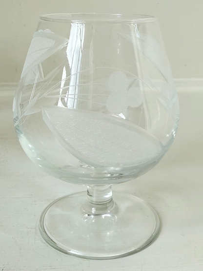 Set of six vintage etched Bailey’s glasses with rounded bowls and short stems, photographed on white surface.