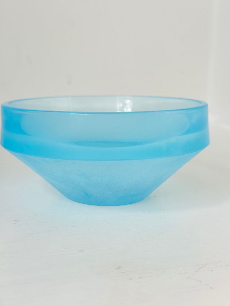 Set of six vintage turquoise midcentury glass bowls with smooth sides, photographed on white surface.