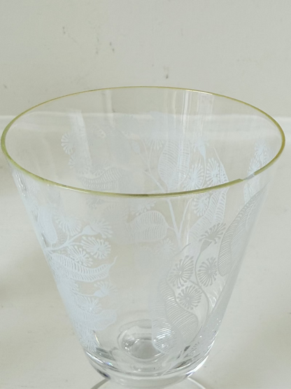 Set of six vintage wine glasses with white floral printed design, photographed on white surface.