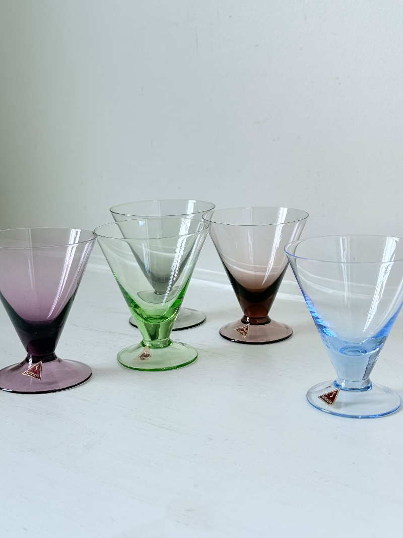 Set of five mid century German martini glasses in coloured glass with ombré effect, photographed on a white surface