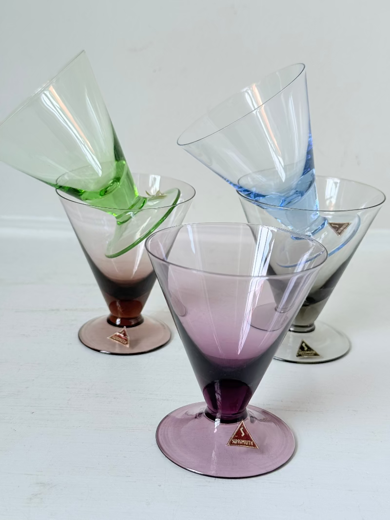 Set of five mid century German martini glasses in coloured glass with ombré effect, photographed on a white surface
