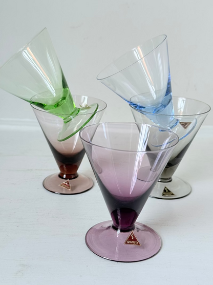 Set of five mid century German martini glasses in coloured glass with ombré effect, photographed on a white surface