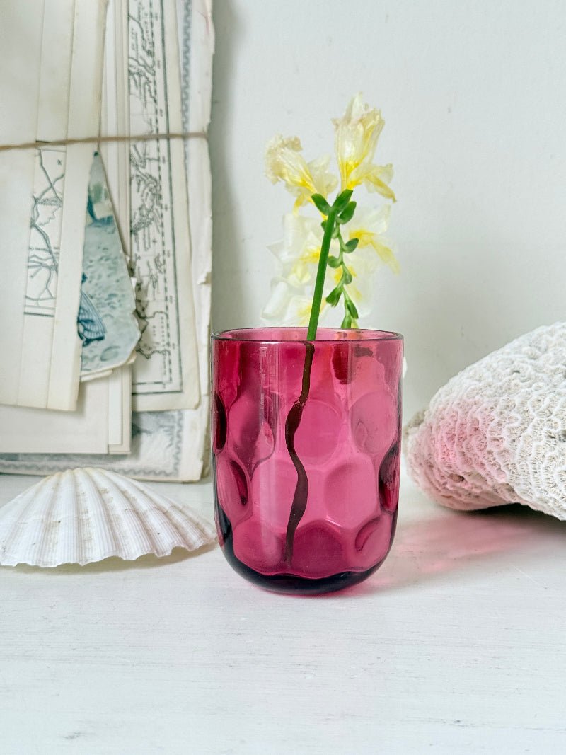 Vintage cranberry glass beaker with honeycomb optic pattern, deep pink colour and textured moulded glass for shelf styling
