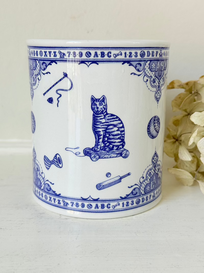 blue and white spode moneybox with sporting scene design, photographed on white surface