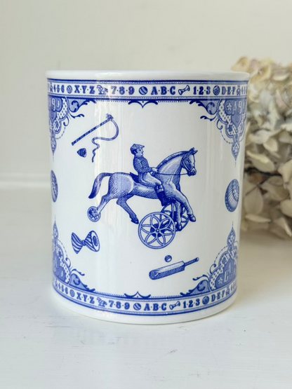 blue and white spode moneybox with sporting scene design, photographed on white surface