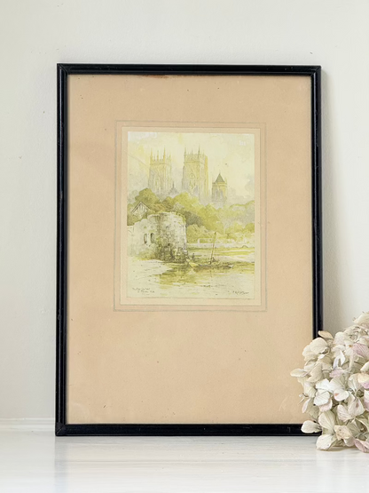 framed print of york minster and city walls in black frame, photographed on white surface